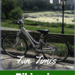bike with central park and nyc skyline in background with text "biking in central park"
