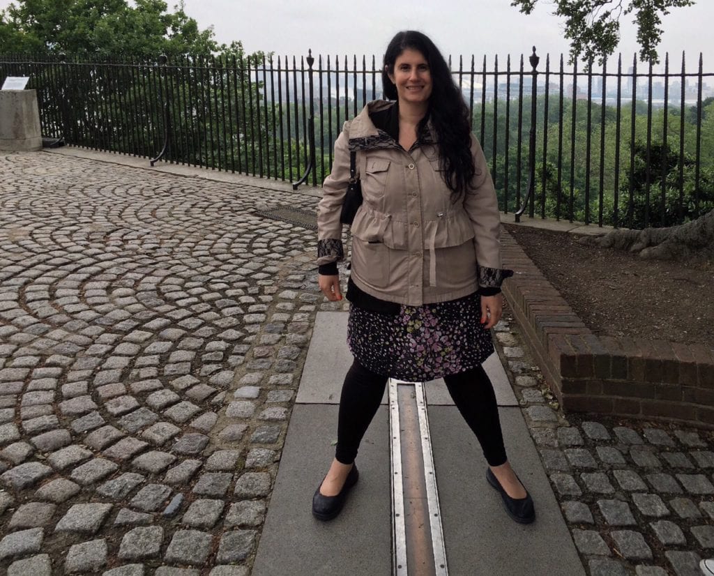 Anisa standing over the Prime Meridian at the Royal Greenwich Observatory. One foot in the Eastern Hemisphere and one foot in the Western Hemisphere.