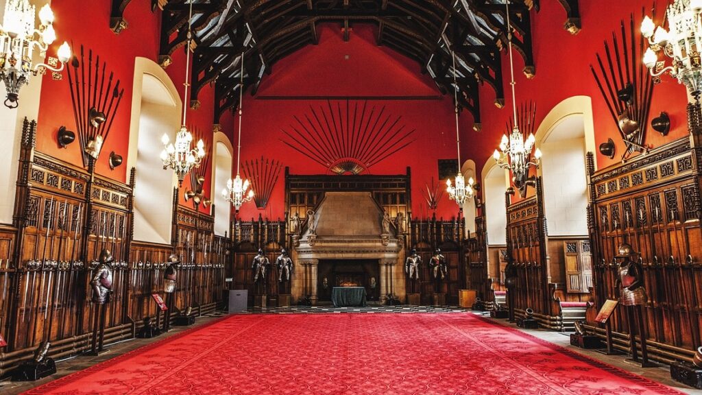 inside the great hall at Edinburgh Castle, its a large red room with a wonderful wooden ceiling