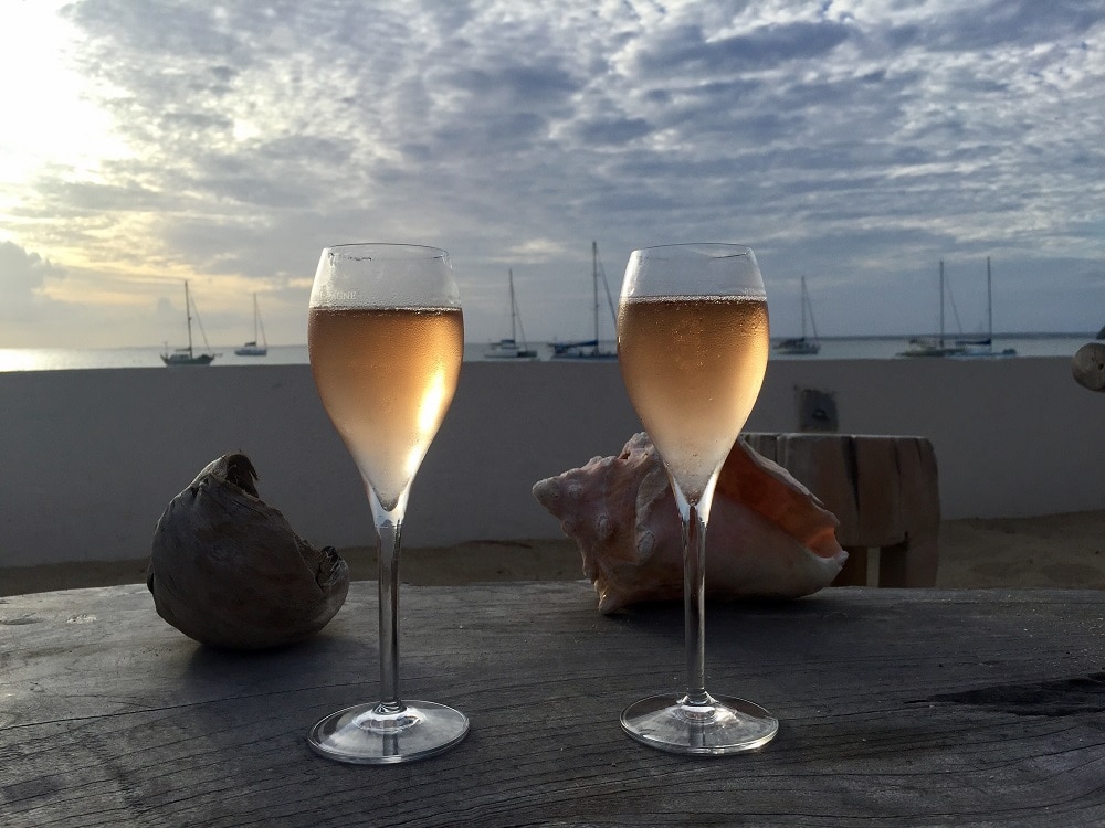 With the money we saved on fees we could have some wine when we landed in St. Martin. - "Travel Fees We Hate and How to Avoid Them" - Two Traveling Texans