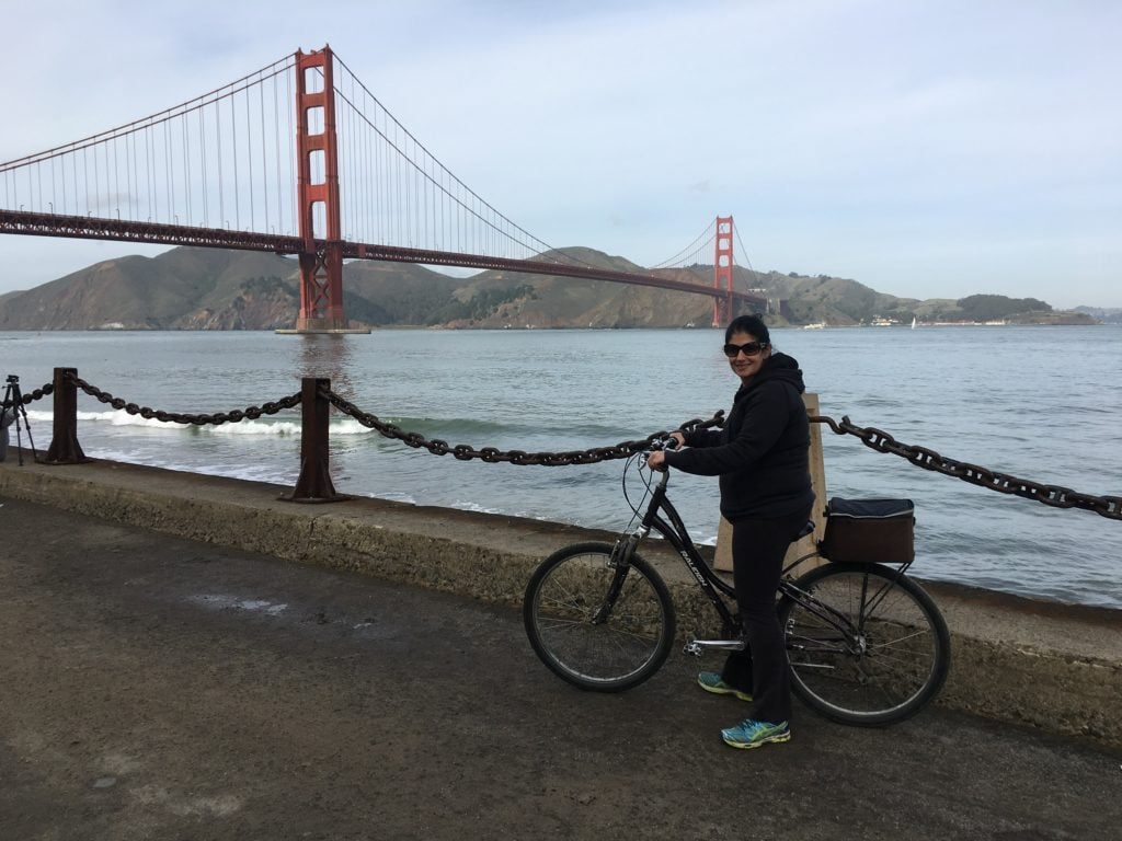 Anisa on her bike headed to the Golden Gate Bridge. - "Biking Across the Golden Gate Bridge: Another off my Bucket List!" - Two Traveling Texans