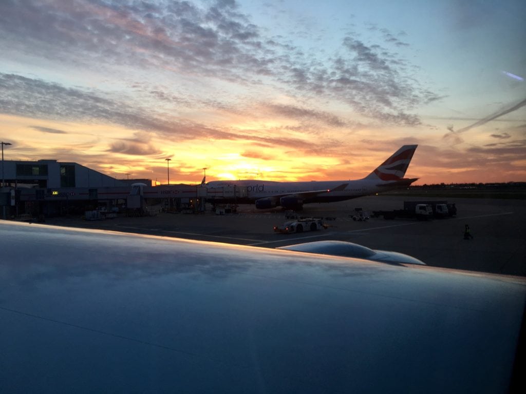 Sunset at Heathrow Airport in London before the long flight back to New York City. - "Neck Support Pillow and Other Travel Sleeping Tips" - Two Traveling Texans