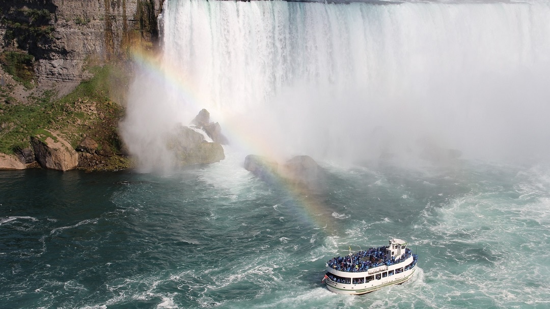 maid of the mist boat next to the american falls in niagara