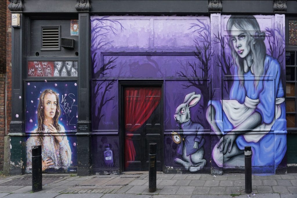 This Alice in Wonderland Mural by Zabou was Russell's favorite. "Free Shoreditch Street Art Tour" - Two Traveling Texans
