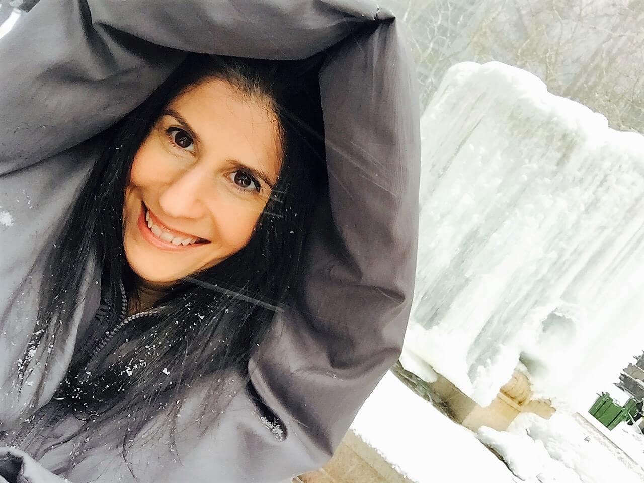 Anisa in front of the frozen fountain in Bryant Park in NYC. - 