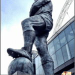 statue in front of wembley stadium with text "Wembley stadium tour review"
