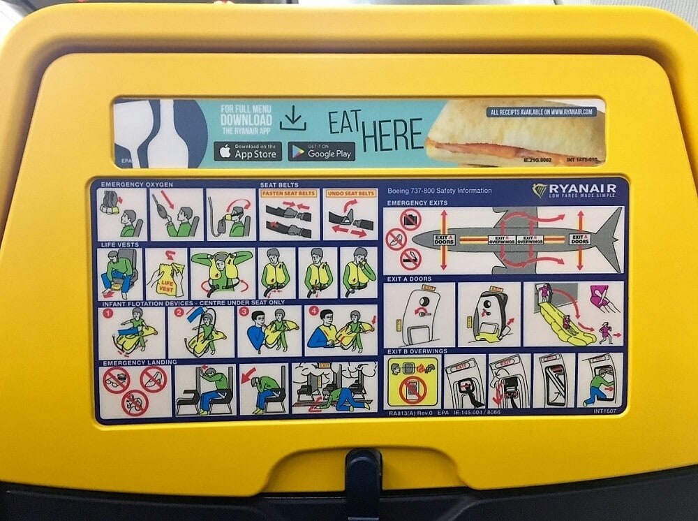 Ryanair seat with safety instructions and advertisement
