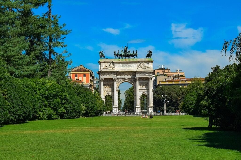 Parco Sempione in Milan, green grass with the famous arch in the distance