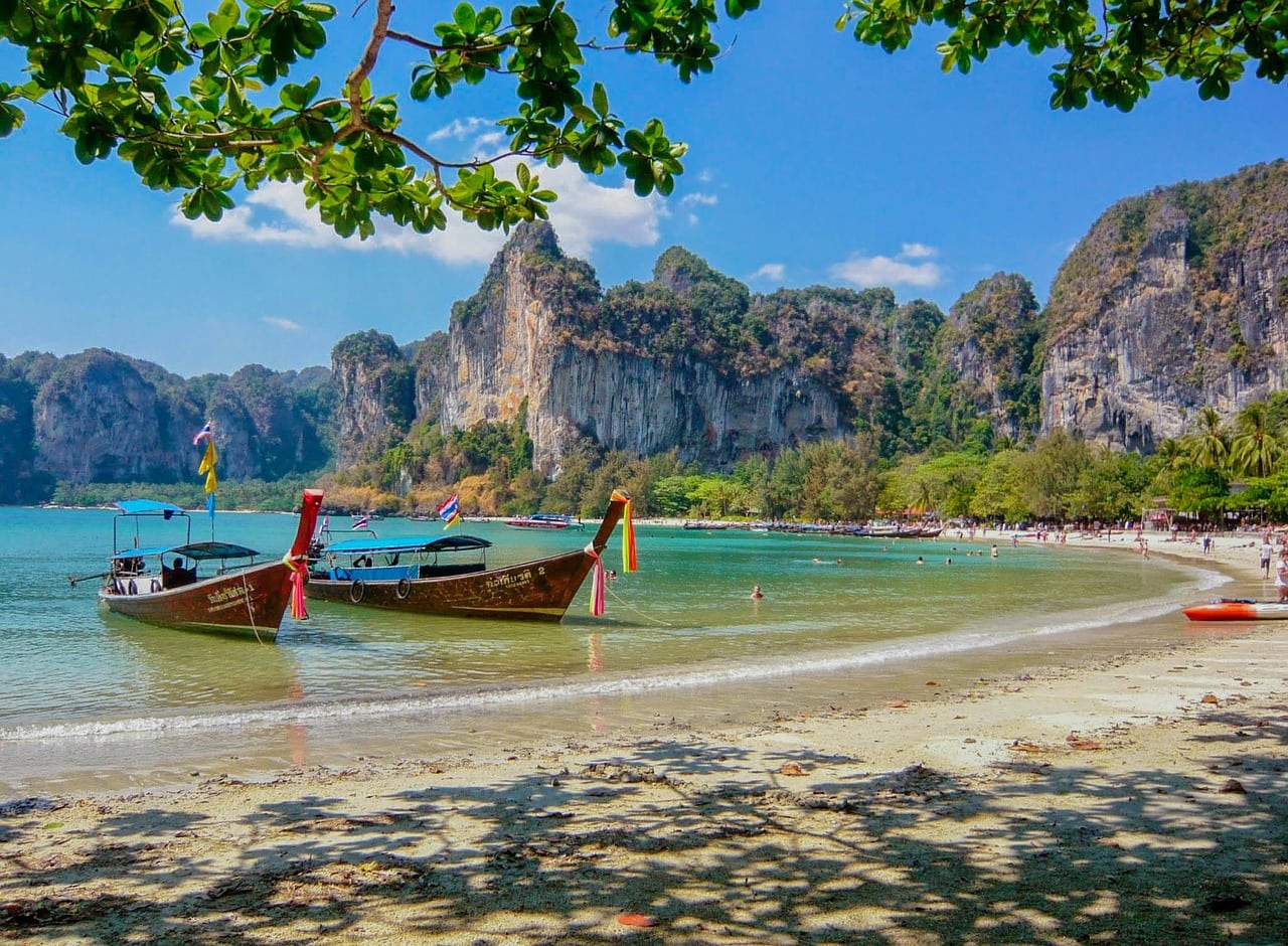 boats by the beach in thailand