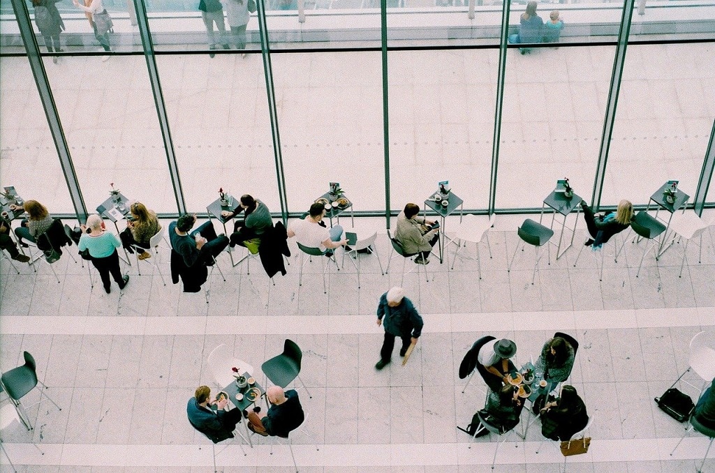 overhead shot of people meeting at a coffee shop