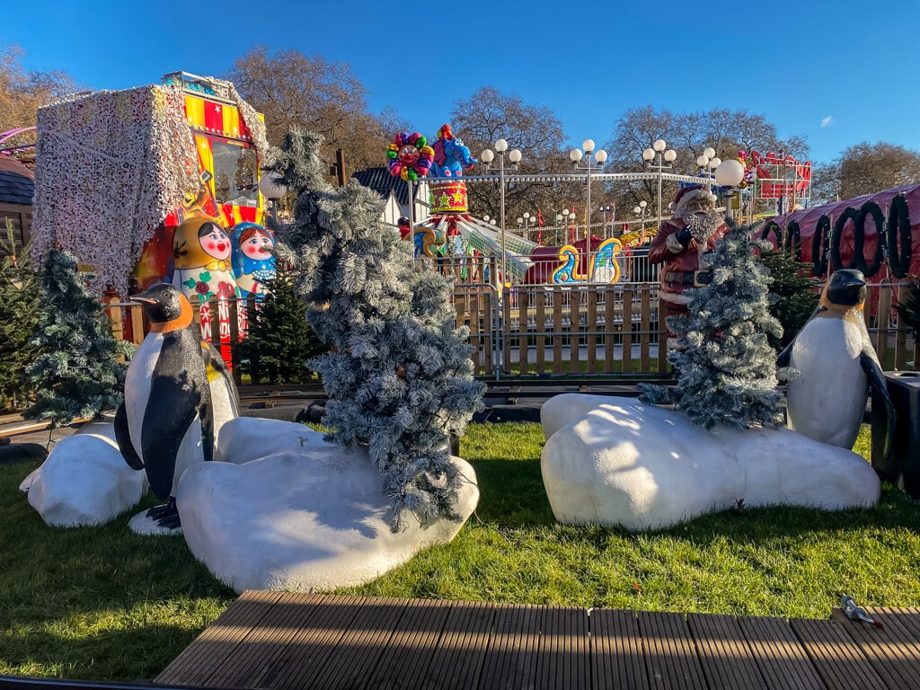 winter decorations with carnival rides in the background