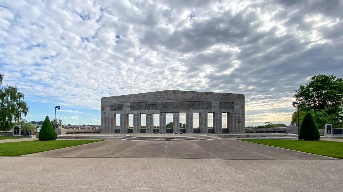 saint quentin war memorial with a dramatic sky