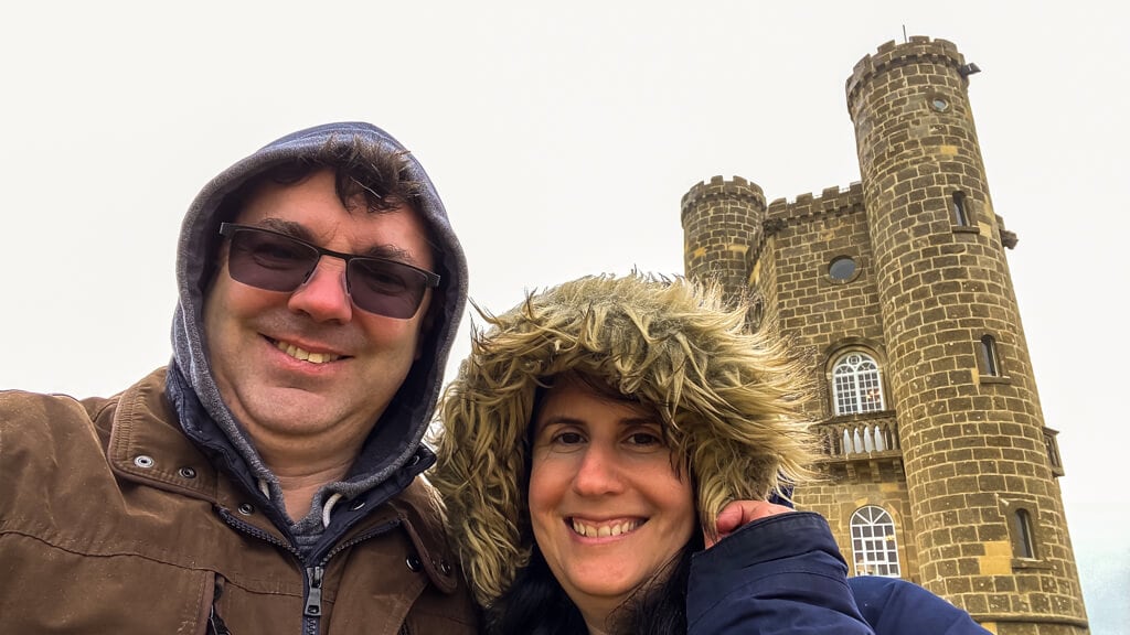 selfie of Russell and Anisa by Broadway Tower with hoods up