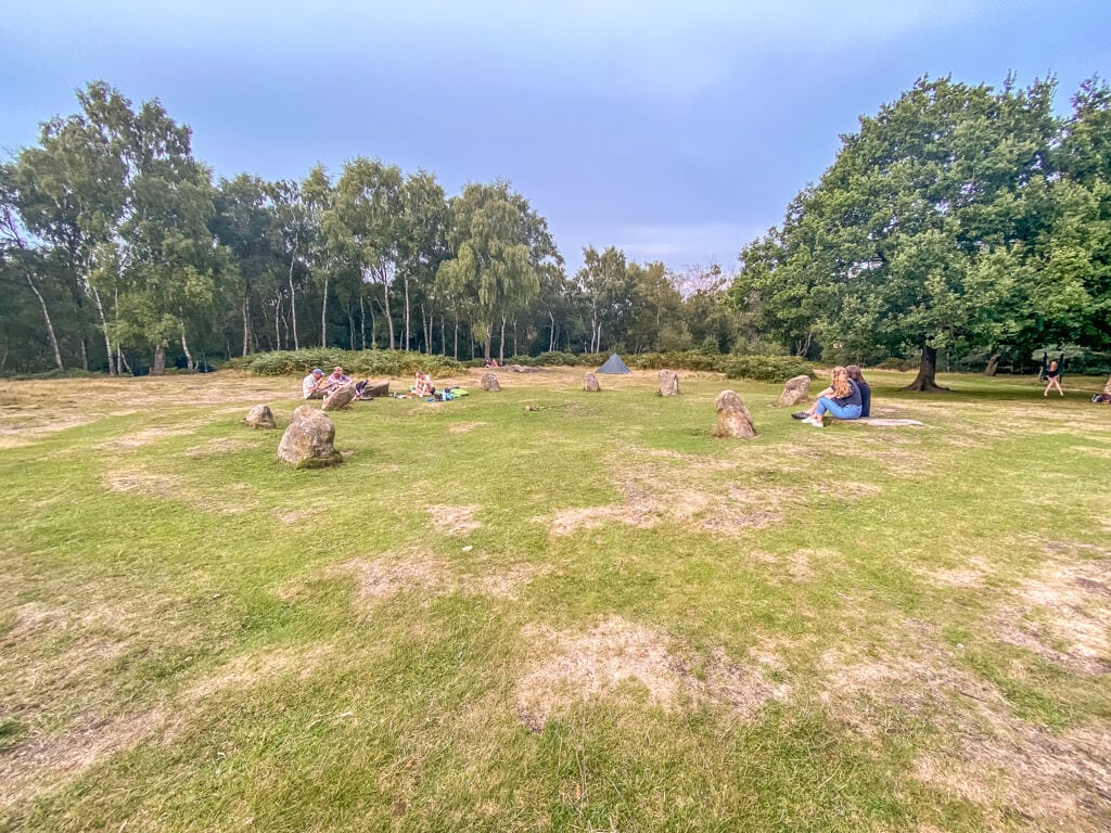 people relaxing a picnicking at the nine ladies stone circle