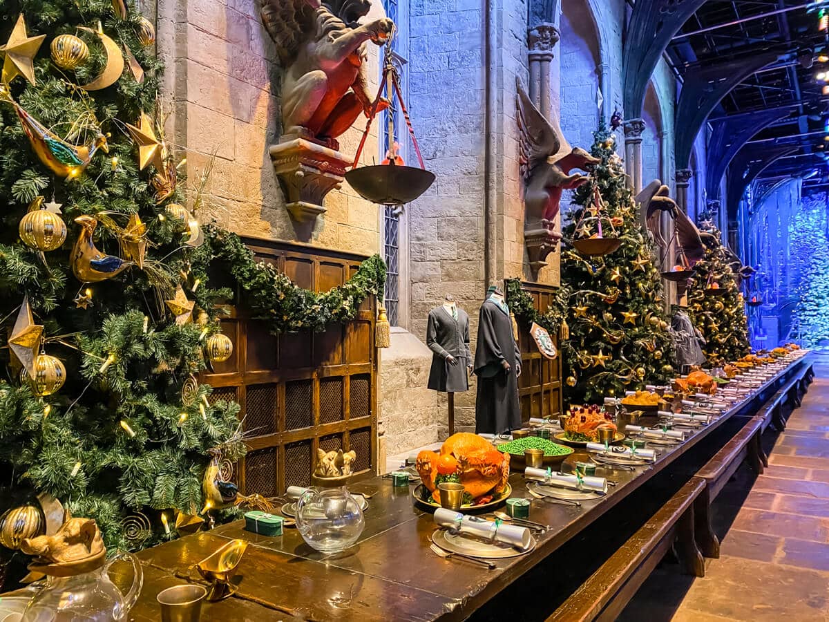 tables in the great hall studio laid for christmas feast