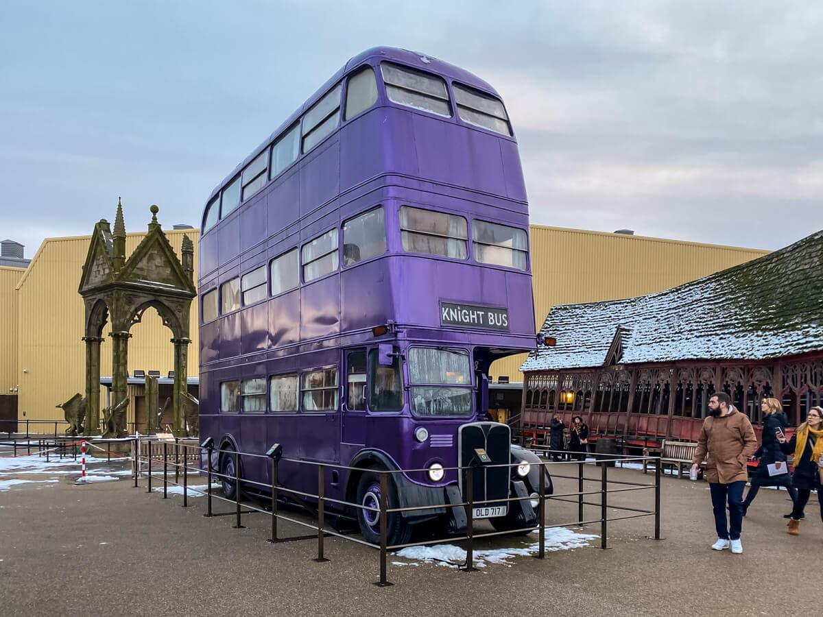 purple triple decker knight bus