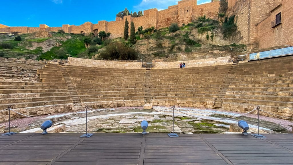 roman theatre in malaga with the alcazaba behind it