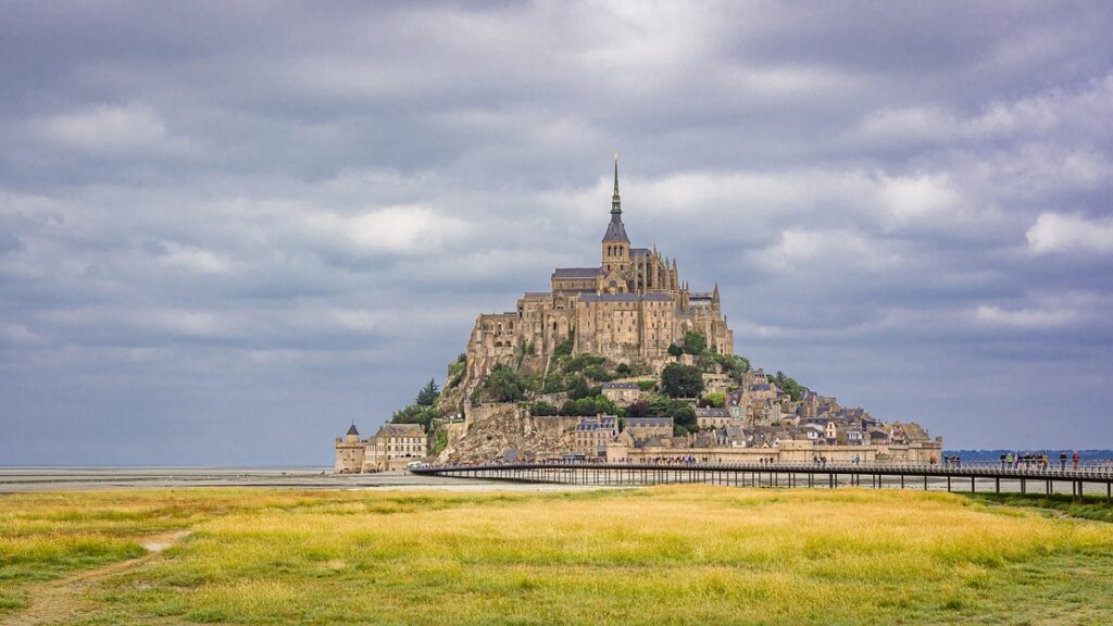 view of mont st michel with a moody sky