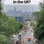 road leading to London with text overlay - Should you rent a car when traveling in the UK? - UK Travel