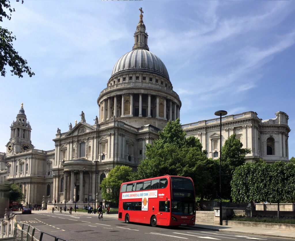 double decker bus traveling past St. Paul's in London