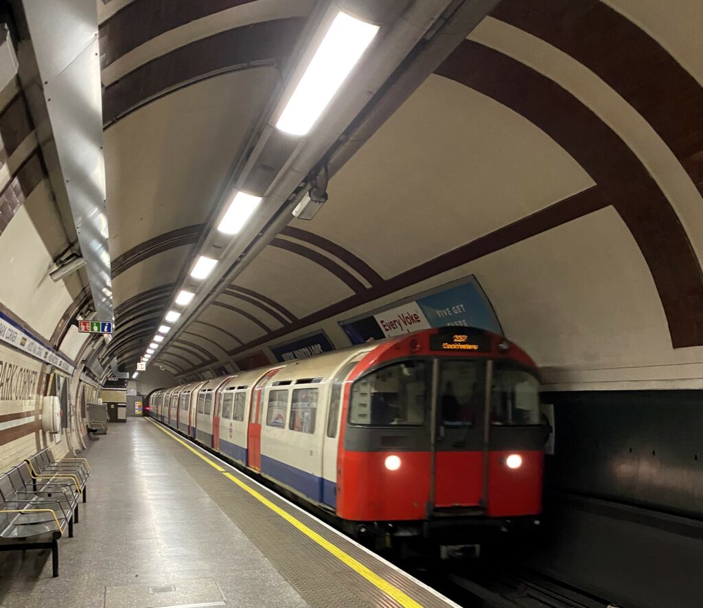 train entering an underground station in london